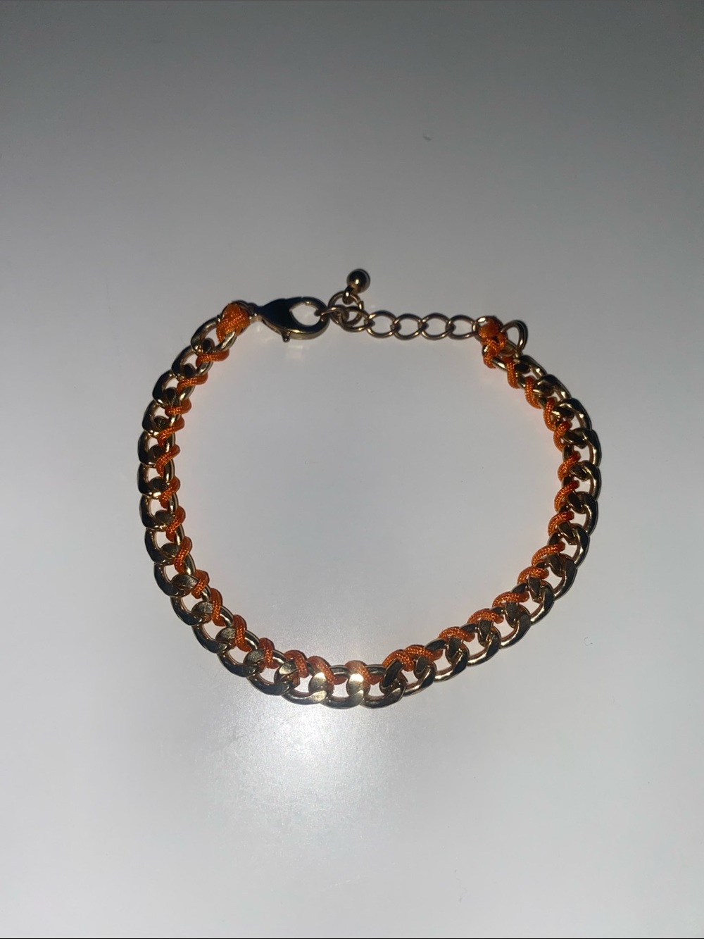 Gold Chain Bracelet with Orange Thread Accent